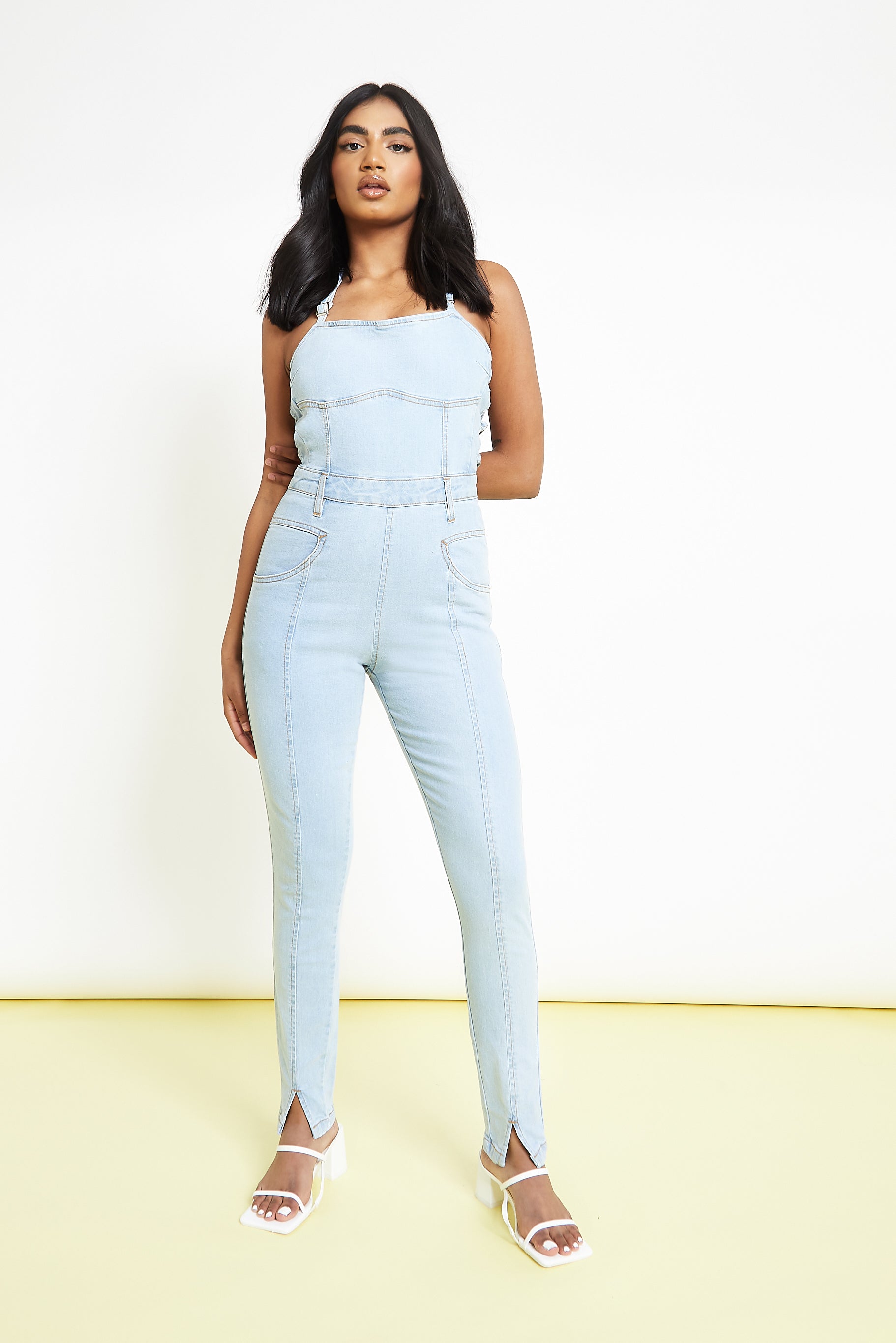 SLEEVELESS DENIM JUMPSUIT - LIGHT BLUE WASH