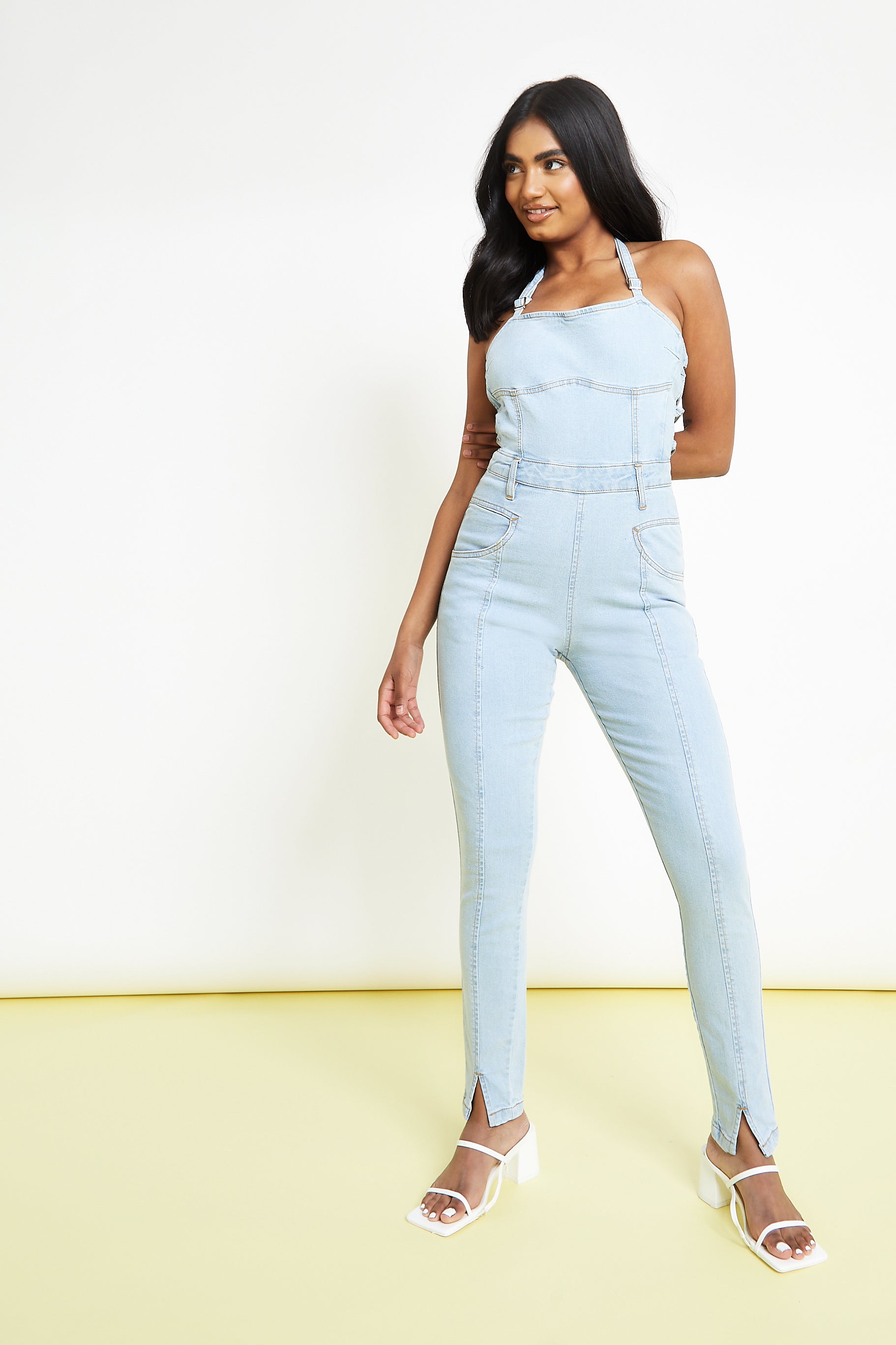 SLEEVELESS DENIM JUMPSUIT - LIGHT BLUE WASH